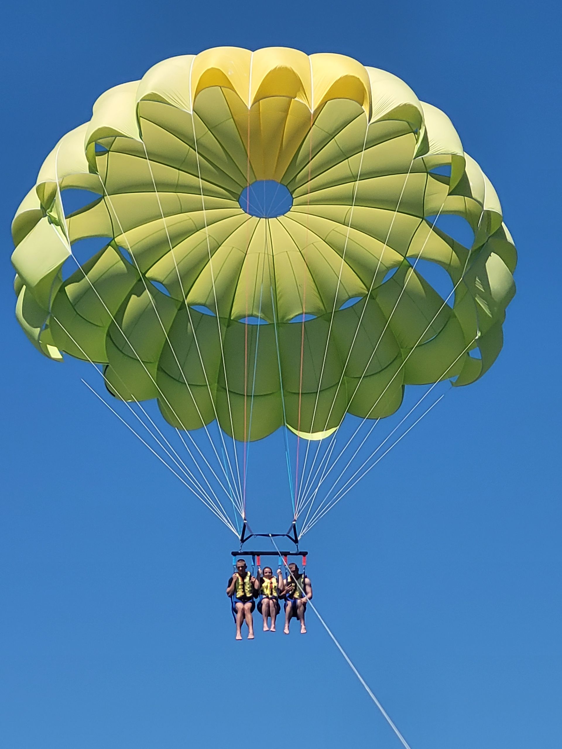 Happy couple tandem parasailing in Rovinj, Croatia