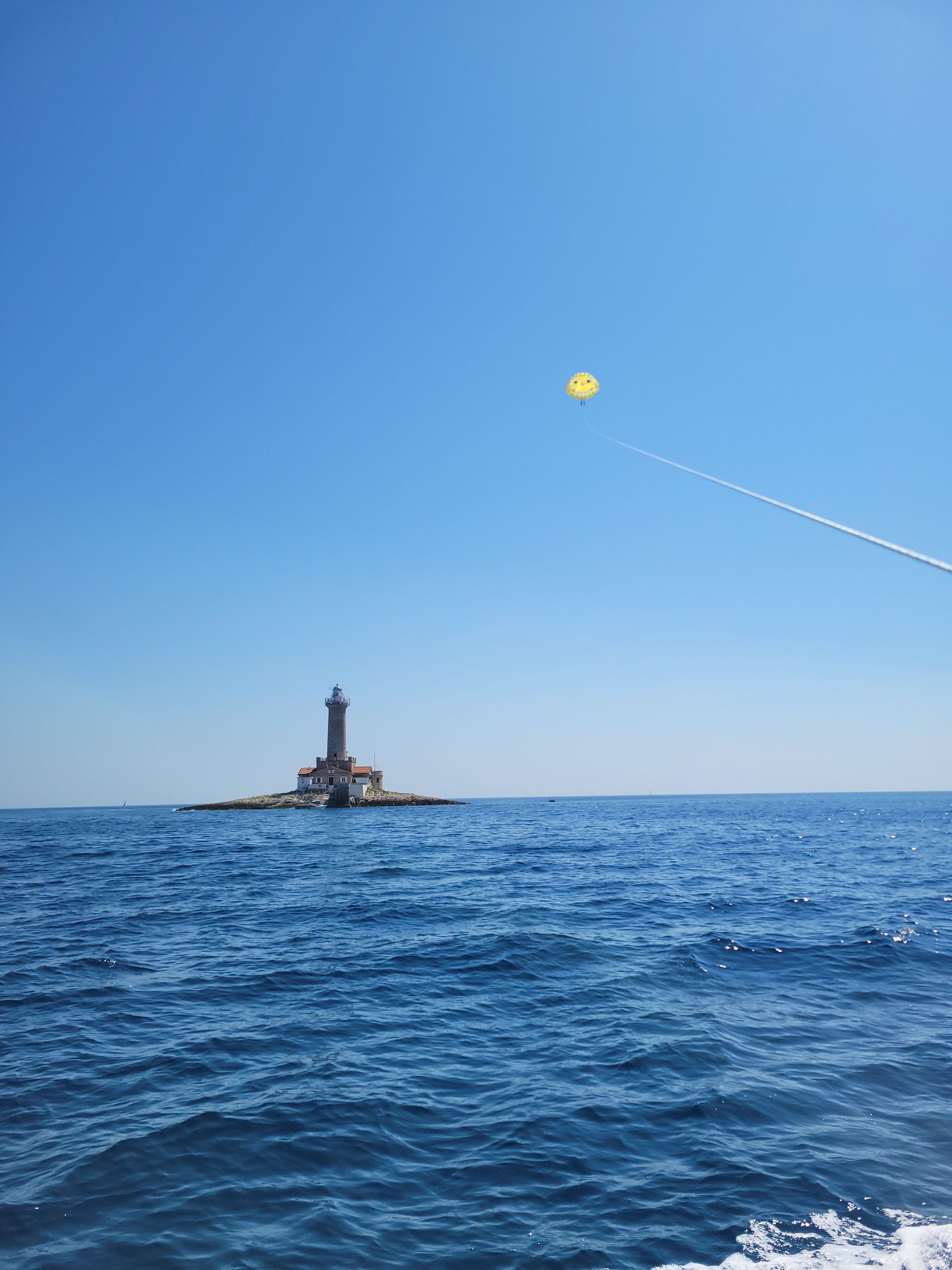 Stunning panoramic parasailing view of Rovinj old town and St. Euphemia Church