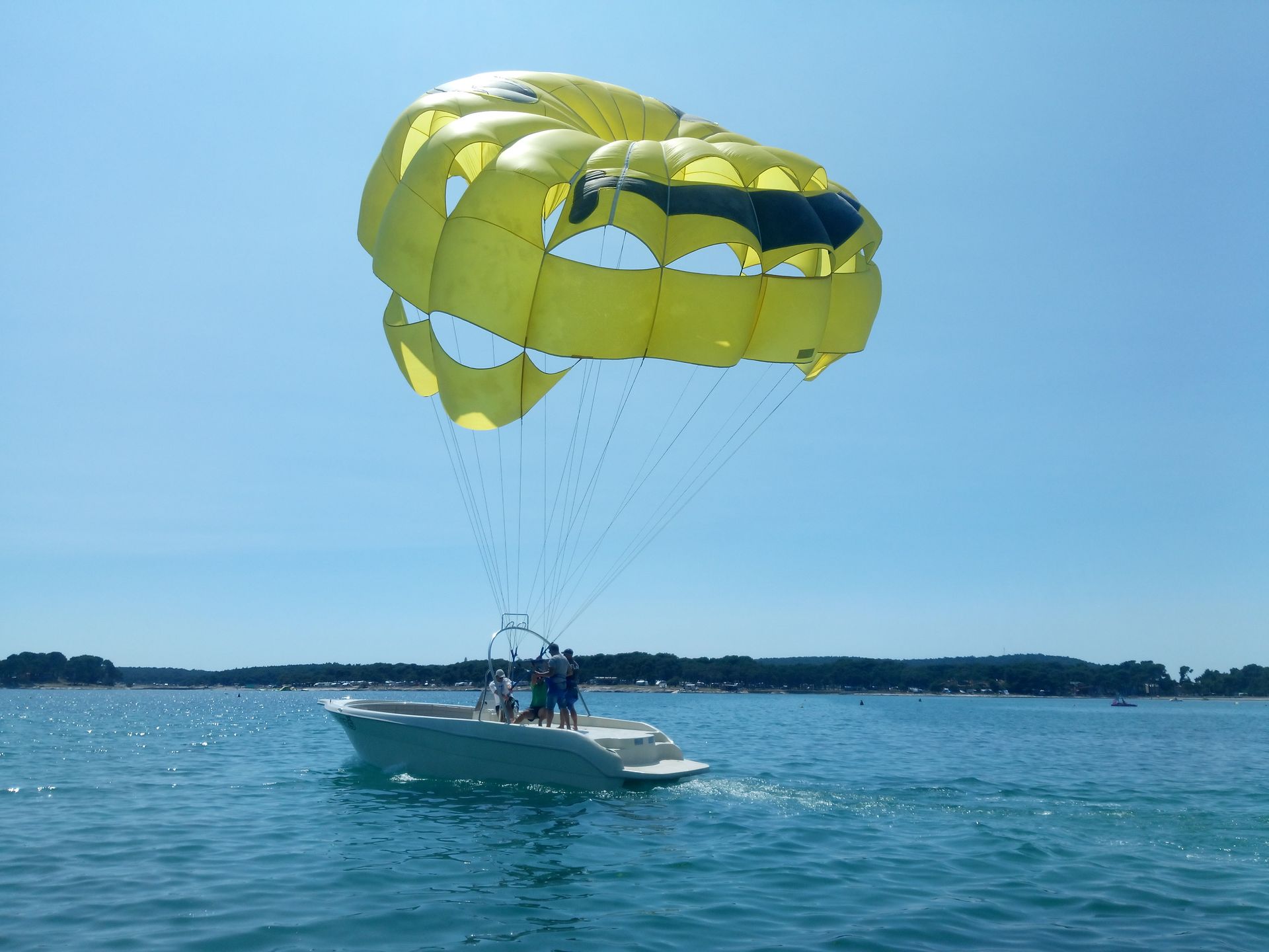Smiling parasailing participants after flight at ACI Marina Rovinj