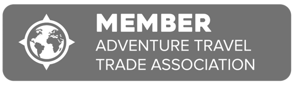 Gray membership badge reading “MEMBER” and “Adventure Travel Trade Association” with globe icon