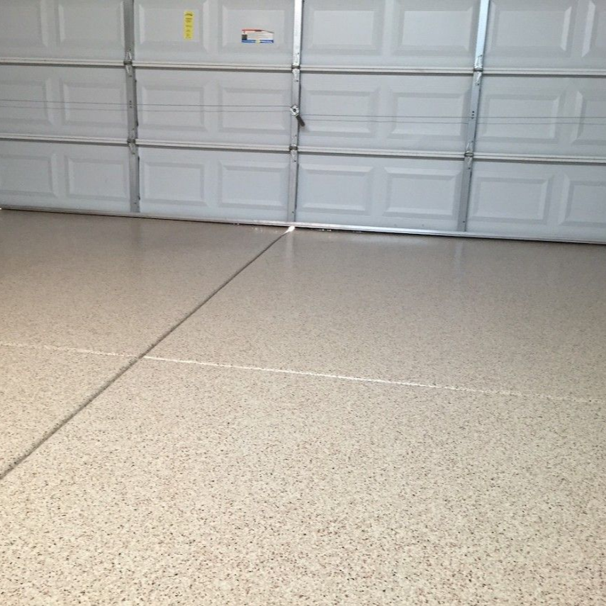 Avon garage floor Flake garage floor coating installed in a residential garage in Avon, Ohio.