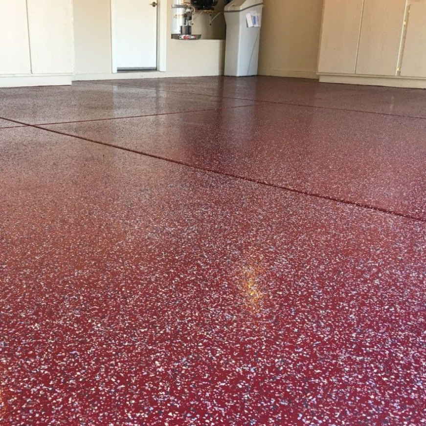 Willoughby flake floor Flake garage floor coating installed in a residential garage in Willoughby, Ohio.