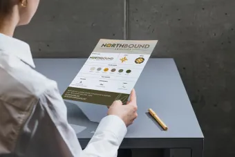 Hand holding business card with