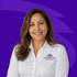 Portrait of a smiling person in a white Farmers Insurance shirt against a purple background