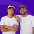 Two smiling men in white T-shirts and caps pose against a purple background
