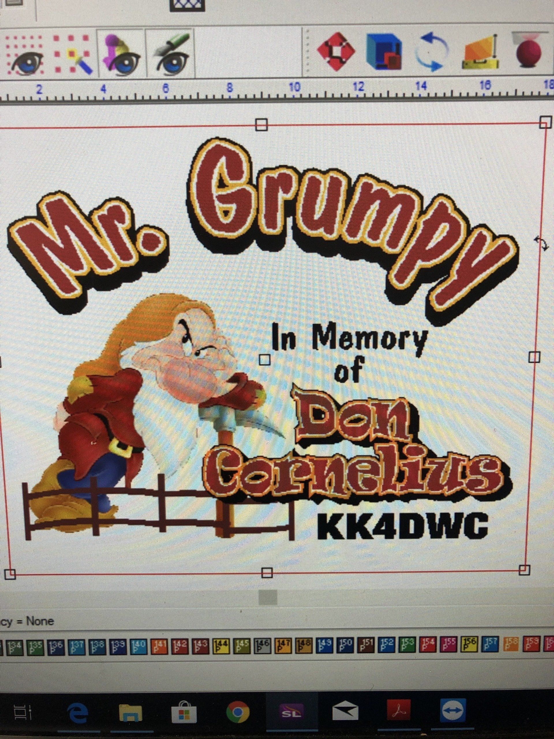 A computer screen shows a picture of mr. grumpy