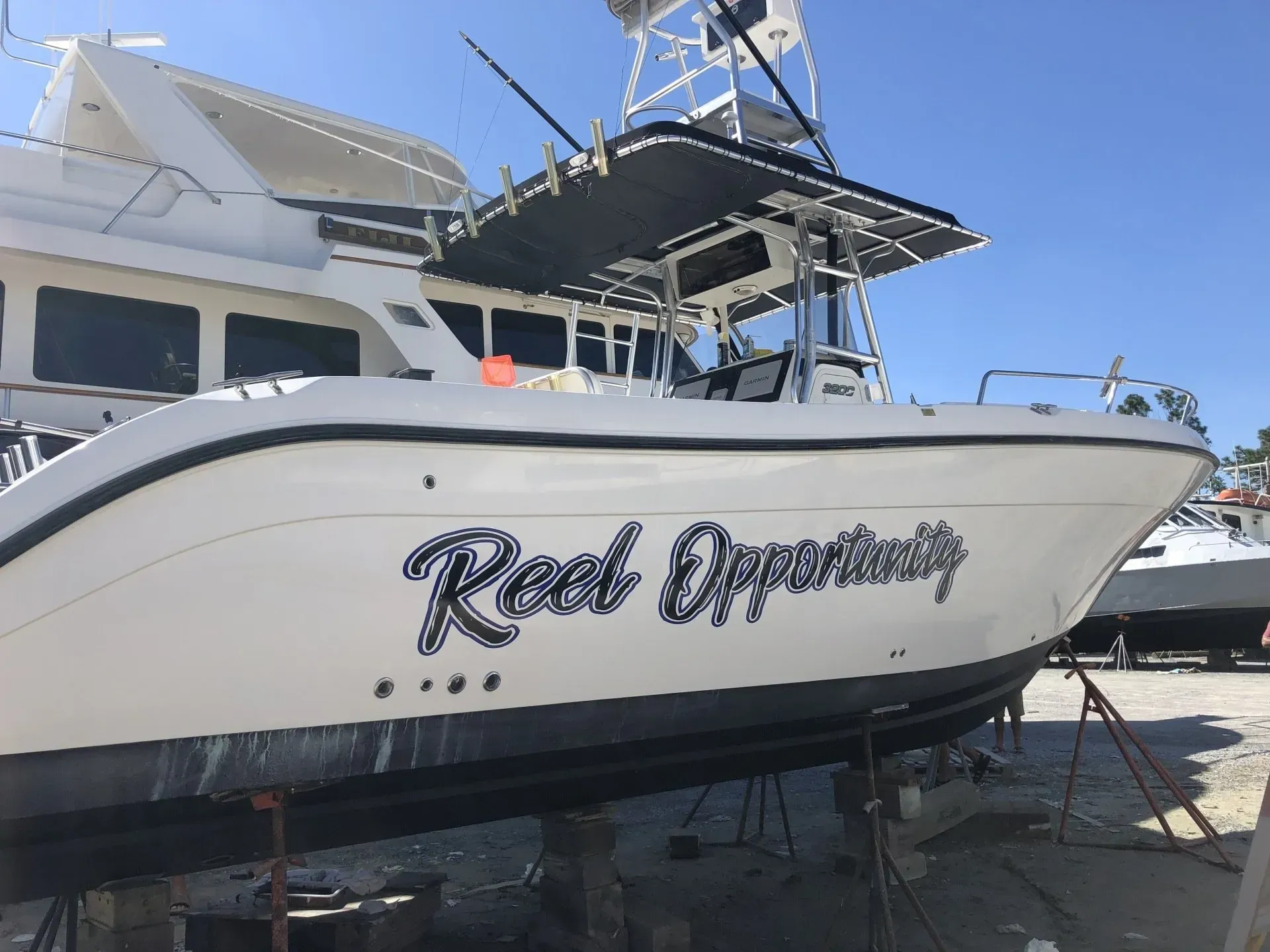 A boat with the name real opportunity on the side of it