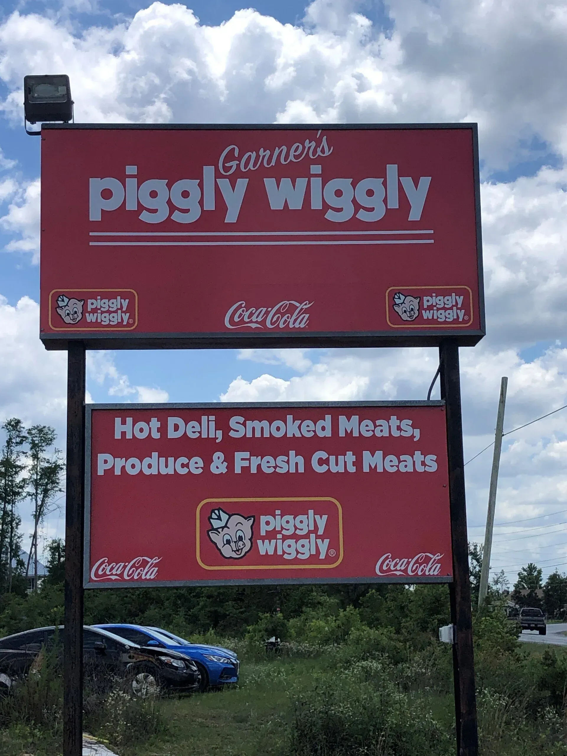 A large red sign for garner 's piggly wiggly