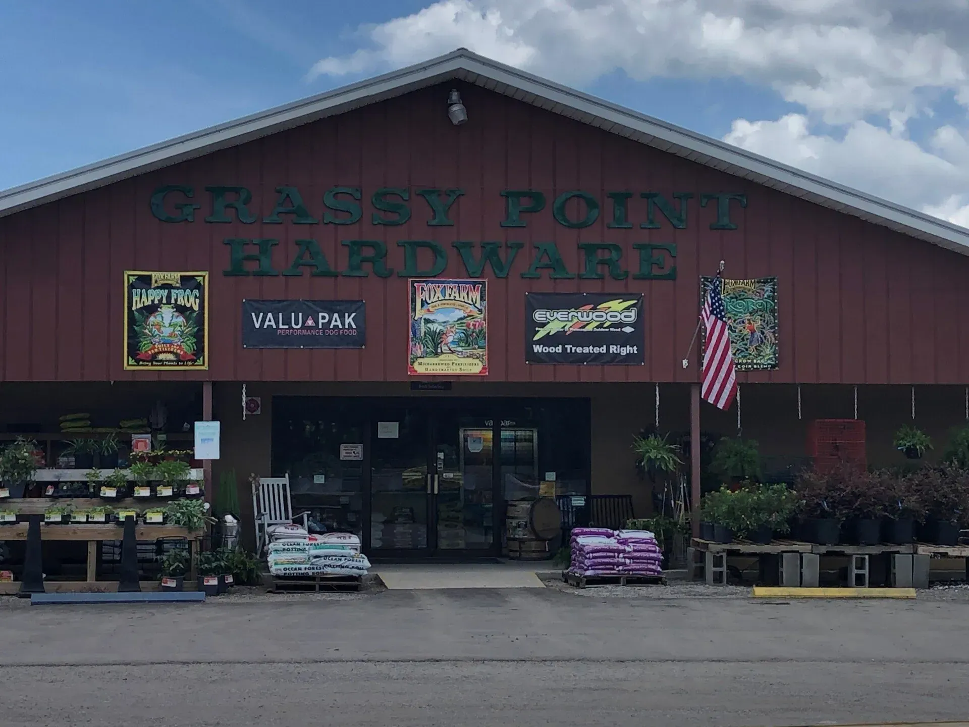 The front of a grassy point hardware store.