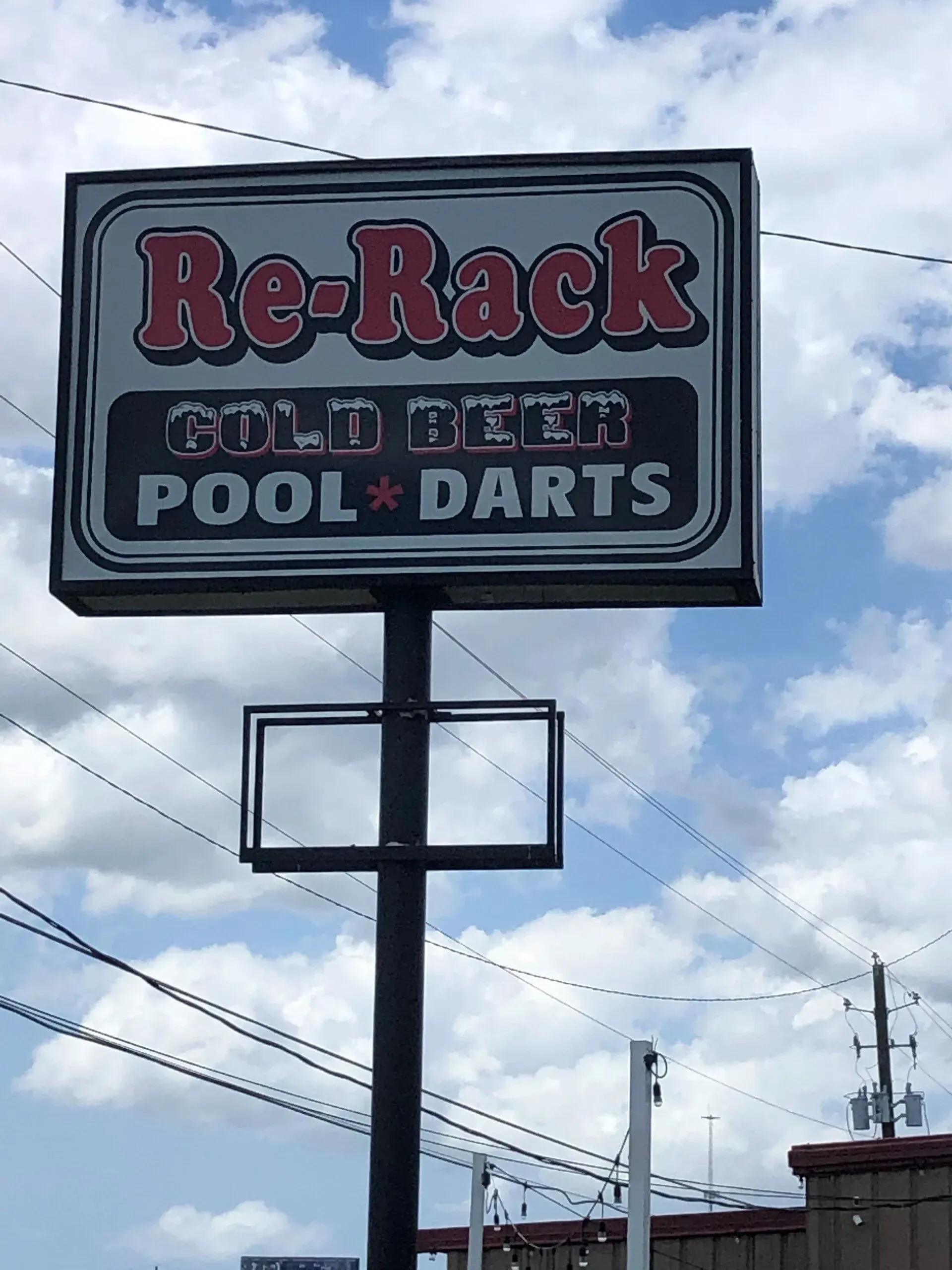 A sign for re-rack cold beer pool and darts