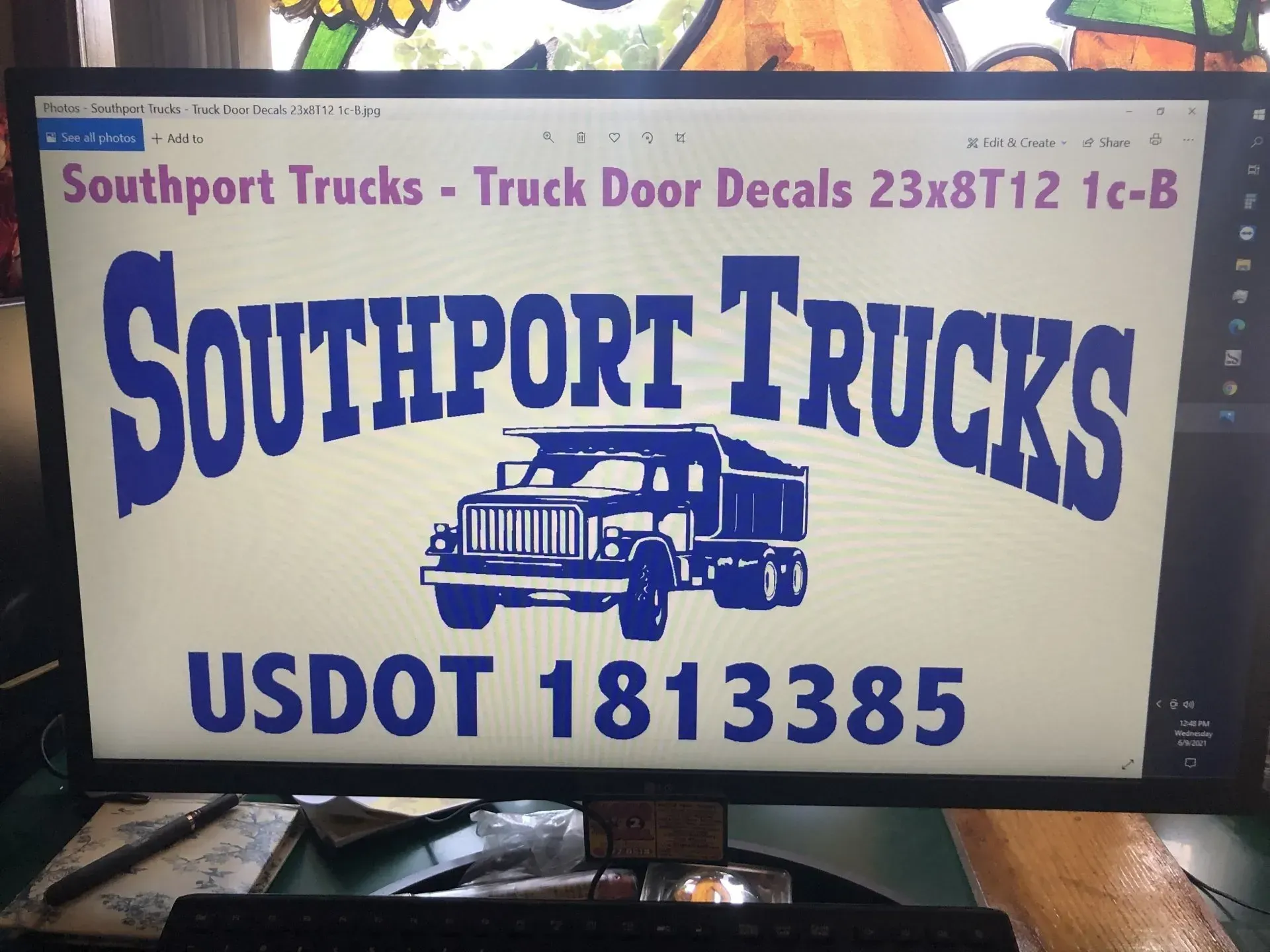 A computer monitor displays a sign for southport trucks