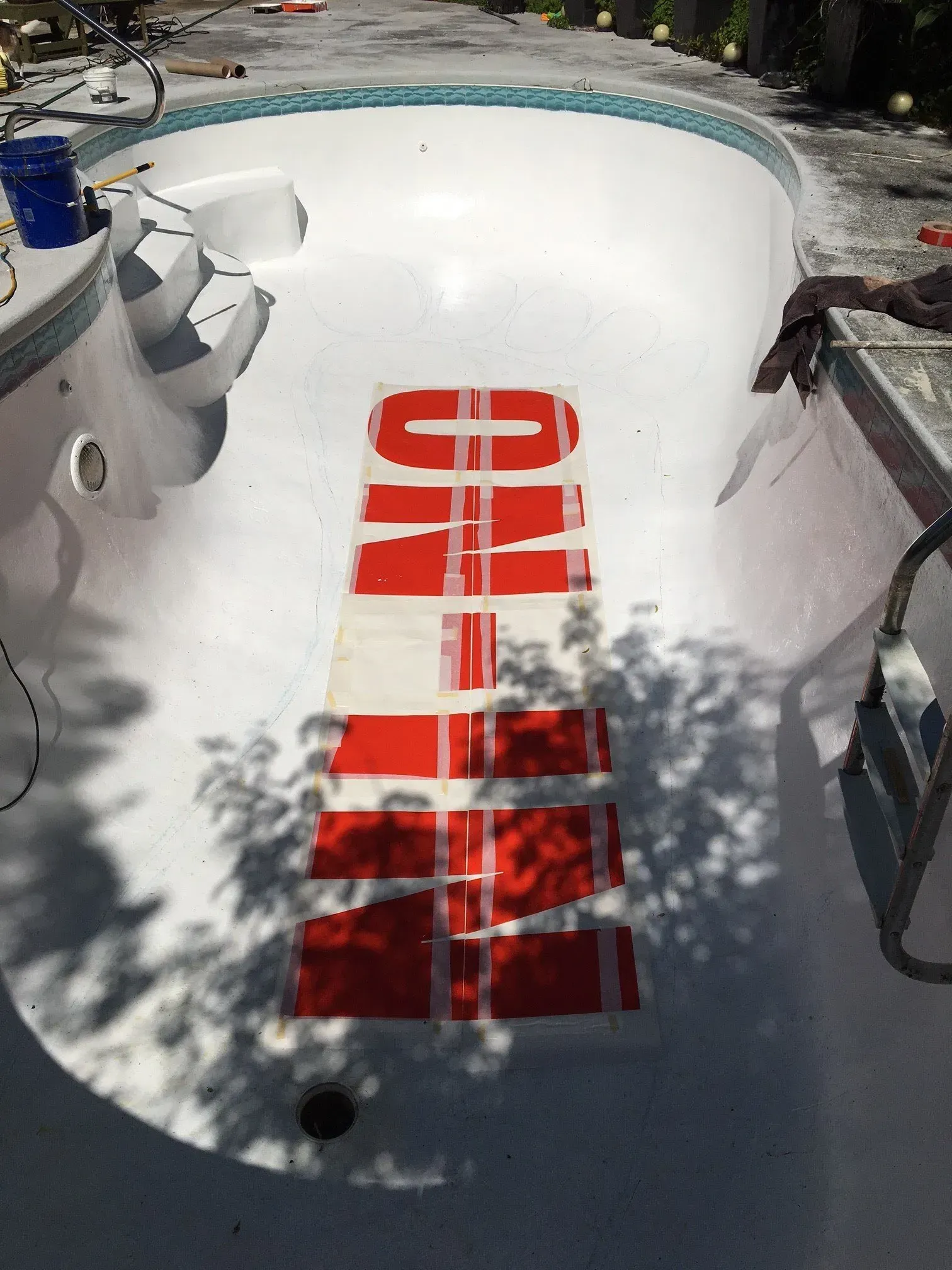 A swimming pool with the word ohio painted on it