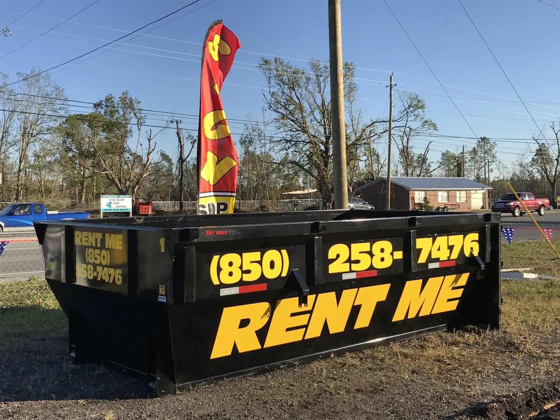 A dumpster with the words rent me on it