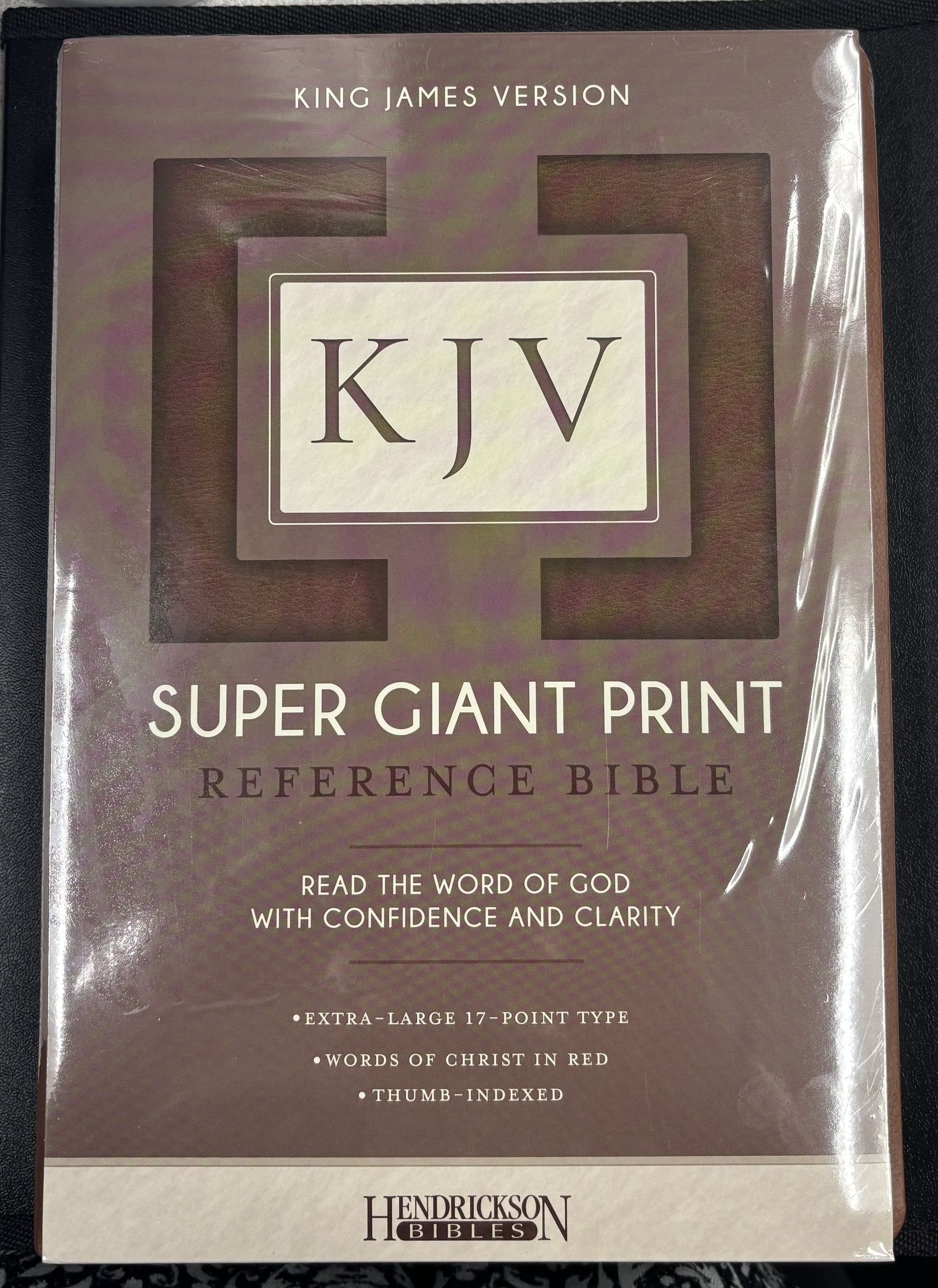 A super giant print kjv reference bible is wrapped in plastic