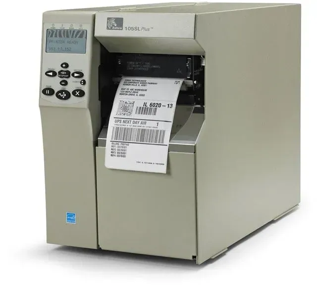 Label printer printing a shipping label, beige desktop machine with a small control panel.