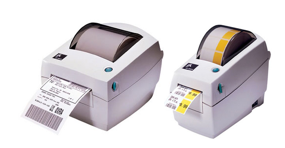 Two white receipt printers printing paper slips, one with black paper and one with yellow paper.