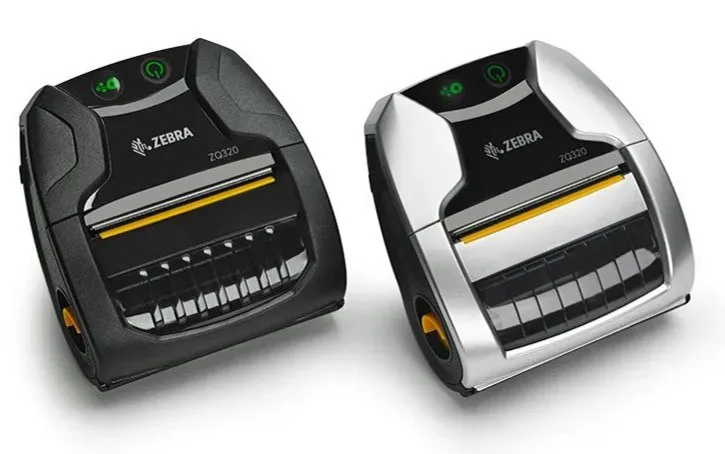 Two compact desktop label printers, one black and one silver, shown side by side.