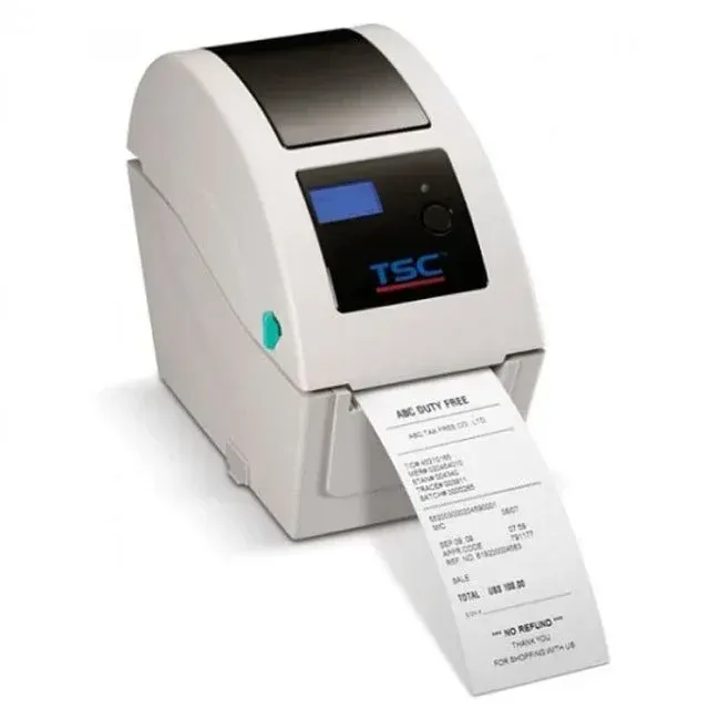 White TSC desktop label printer printing a shipping label
