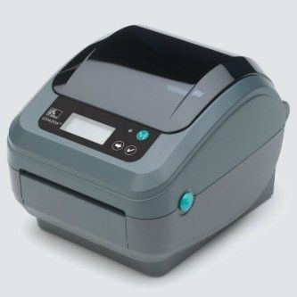 Compact gray label printer with black top panel and small display screen.