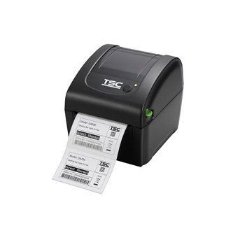 Black TSC label printer printing a white shipping label on a plain background