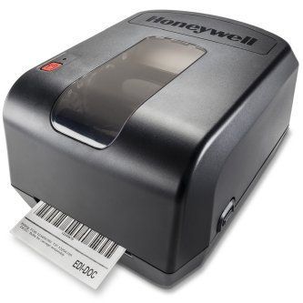 Black Honeywell label printer printing a barcode label