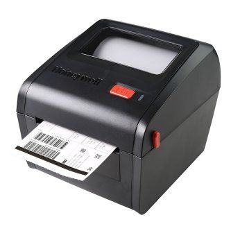 Black desktop label printer feeding out a shipping label