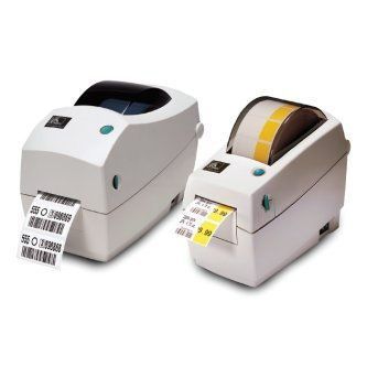 Two white label printers printing barcode labels, one with black and one with yellow labels.