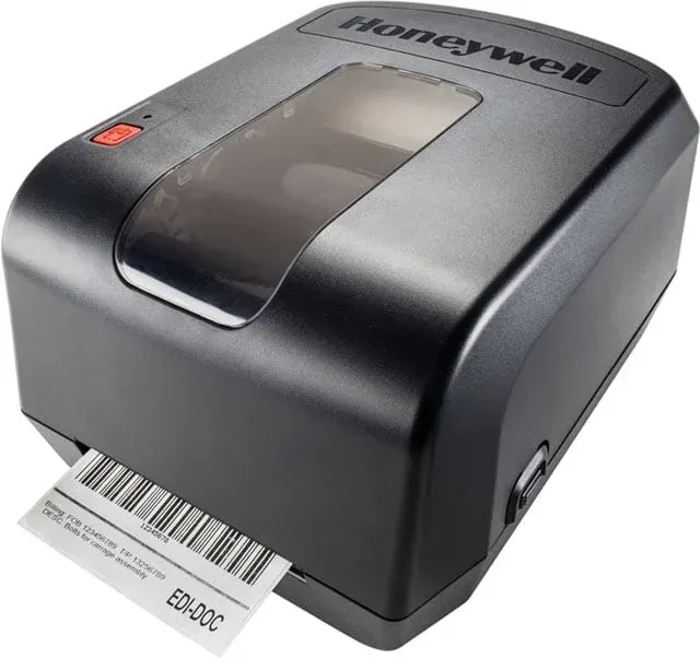 Honeywell desktop barcode label printer printing a shipping label
