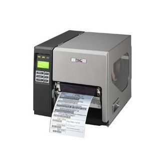Industrial label printer printing a roll of shipping labels, gray and black with a green display