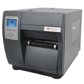 Gray desktop barcode label printer with a small blue display and front output tray