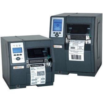 Two dark gray label printers with blue LCD panels and shipping labels on the front
