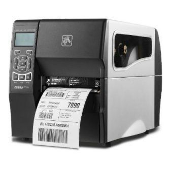 Black and silver desktop label printer printing a barcode shipping label