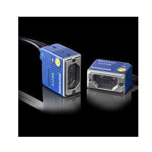 Two blue compact cameras on a black reflective surface, one upright and one lying on its side.