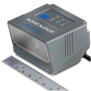 Gray Datalogic barcode scanner with blue button, shown beside a ruler for size reference.