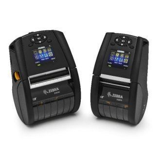Two black Zebra portable label printers with small color screens, shown side by side