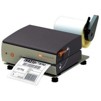Desktop label printer printing a shipping label, dark gray with orange accents