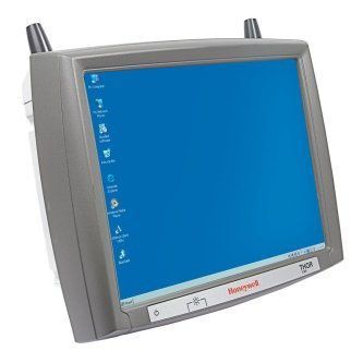 Old Honeywell touchscreen control panel with blue display and gray bezel, angled in view