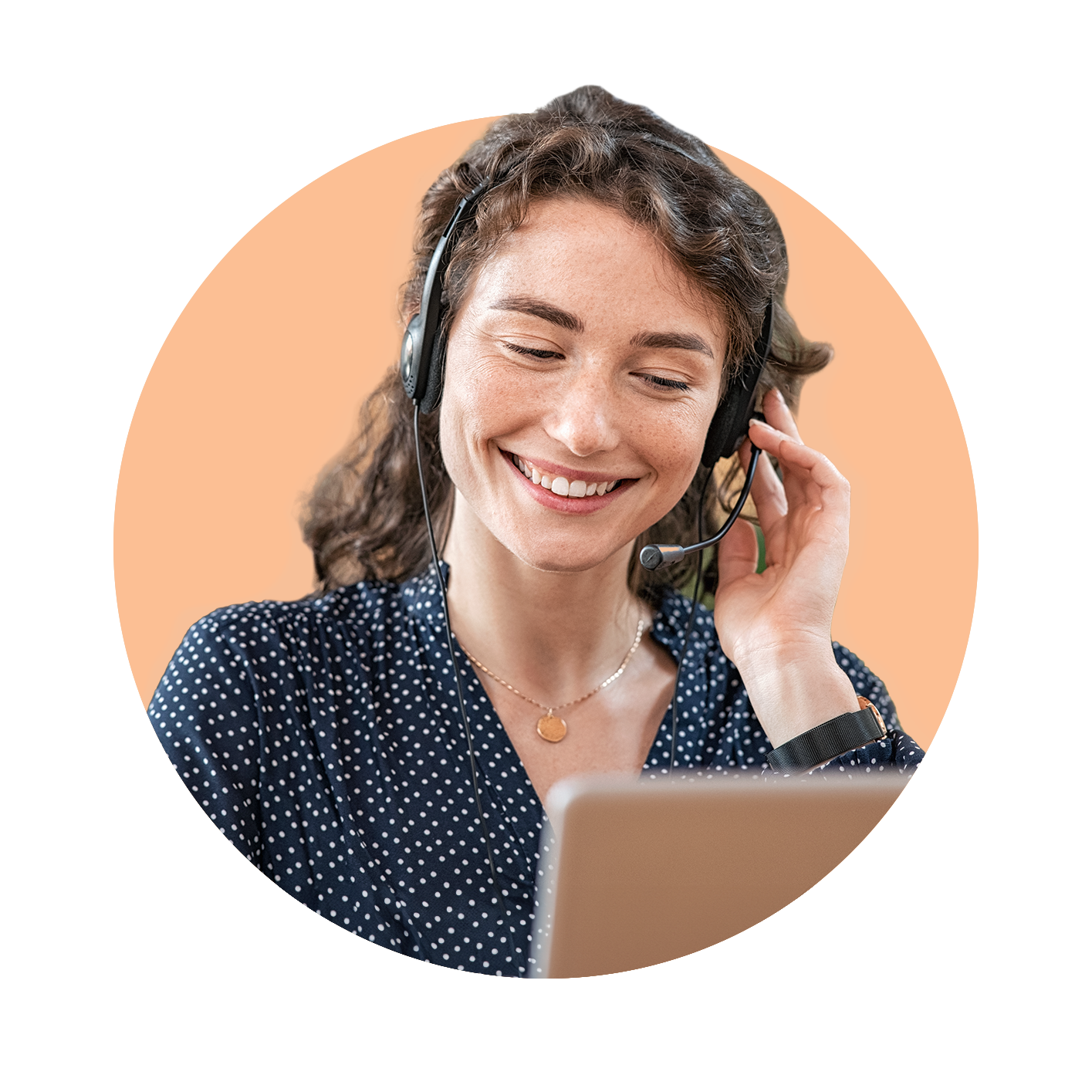 Young professional in front of laptop and with headset on