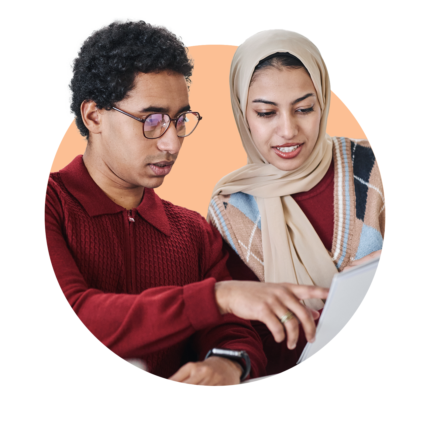 Two young professionals looking at a printed report