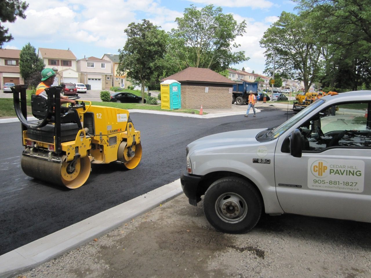 A white truck with the word paving on it