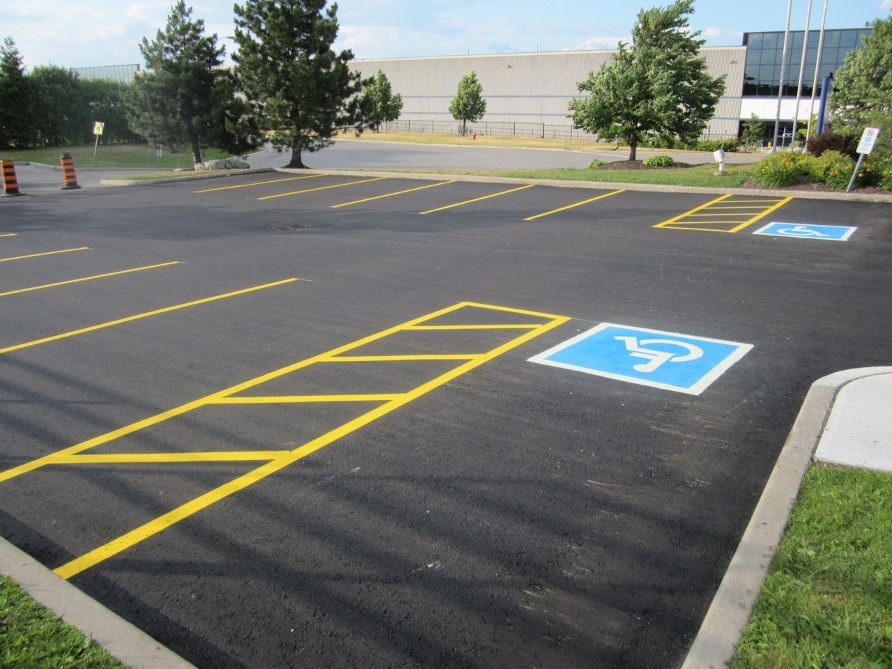 A parking lot with a handicapped parking spot in the middle