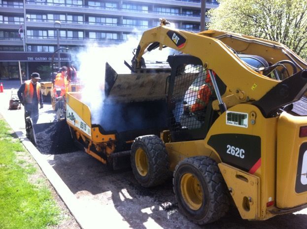 A yellow cat tractor with the number 262c on it