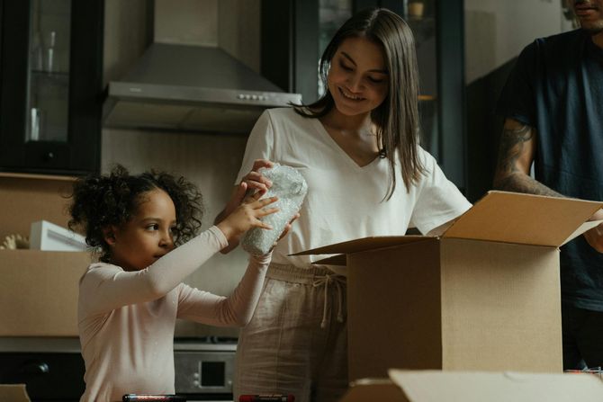 Mother and daughter packing togehter.