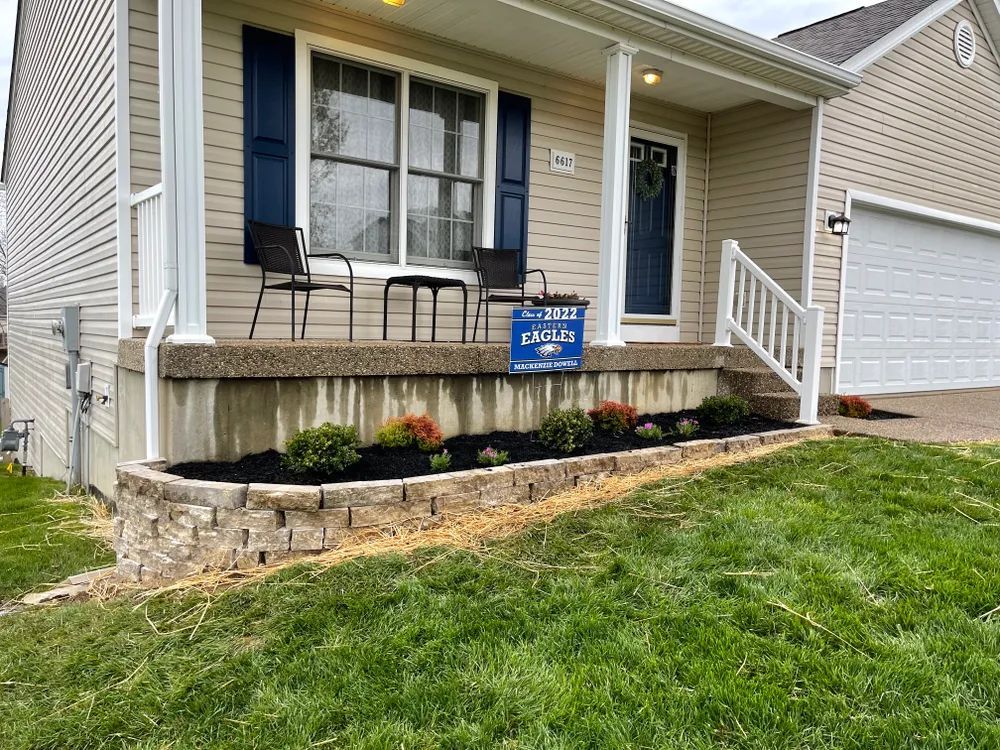 A house with a porch and a sign on it.
