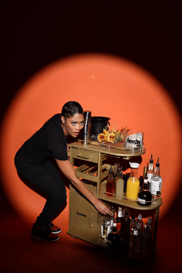 Woman Pushing a Cart — New York City, NY — Boozee Bar