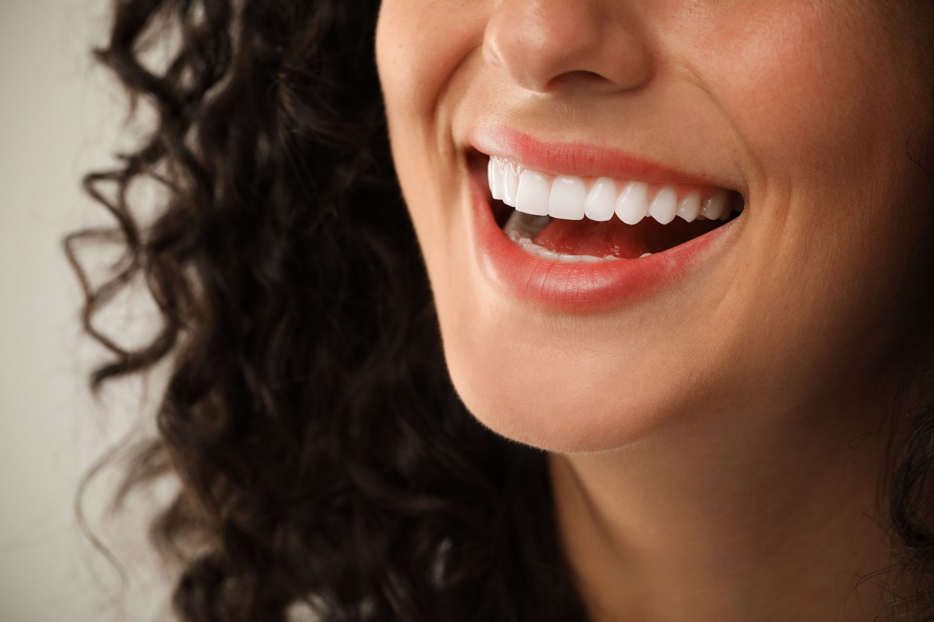 Close-up of a bright, white smile showing the results of cosmetic dental treatment.