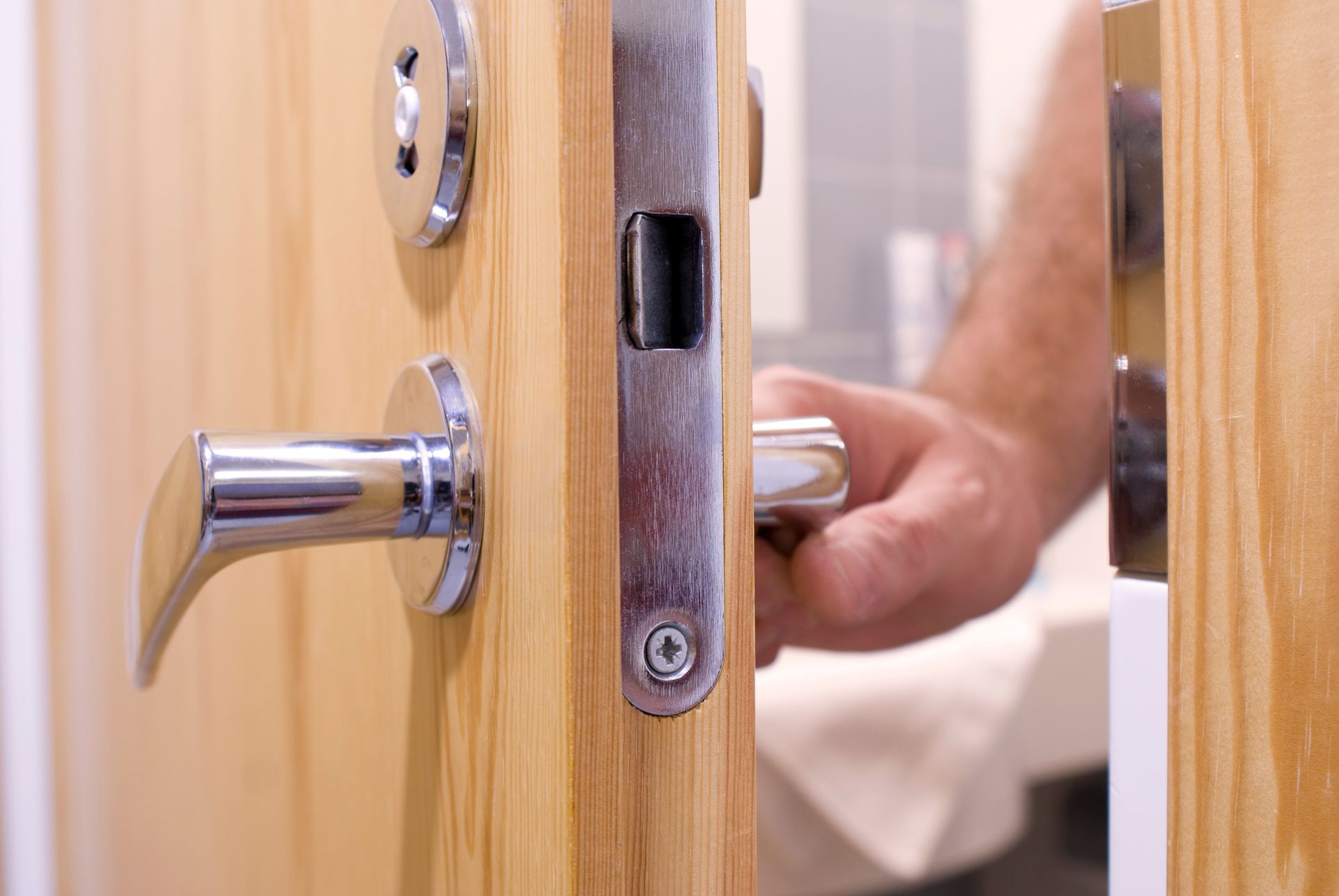 Person is Opening a Door - Miramar, Florida - A Better Keyway Locksmith Person is Opening a Door - Miramar, Florida - A Better Keyway Locksmith