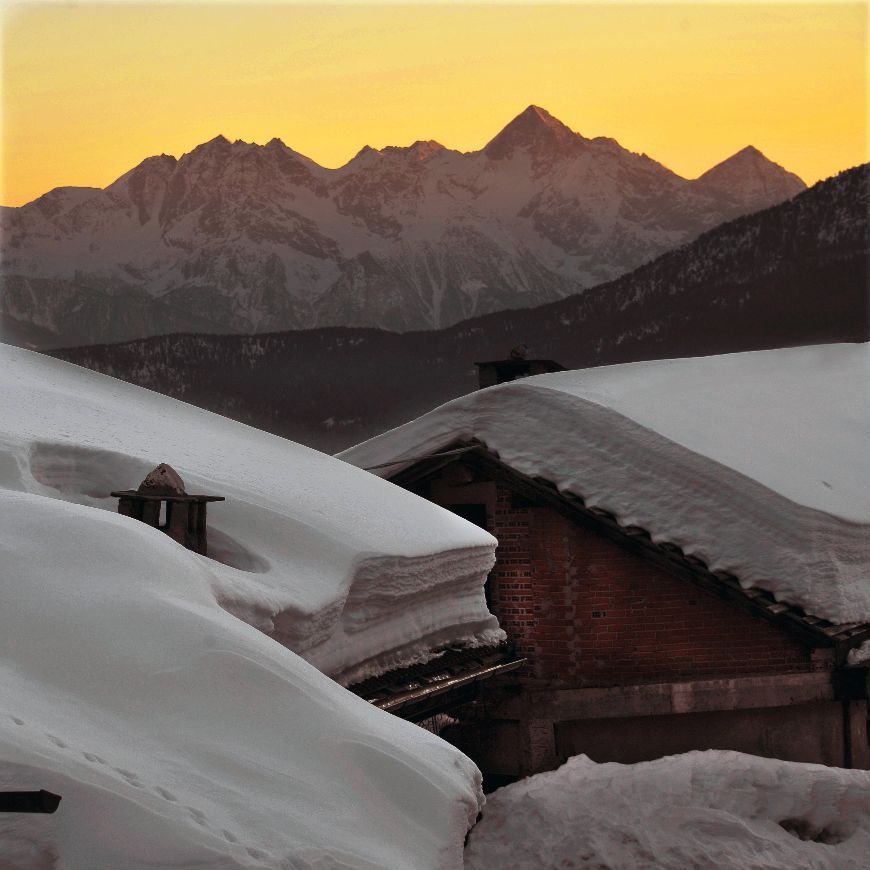 Snow-covered village of Chamois during winter in the Aosta Valley