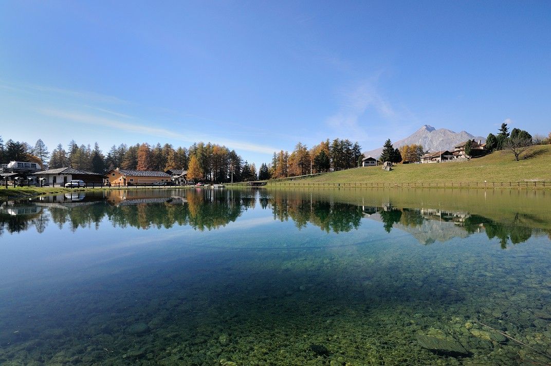E-bike ride by the alpine lake at Col de Joux with mountain views, Aosta Valley