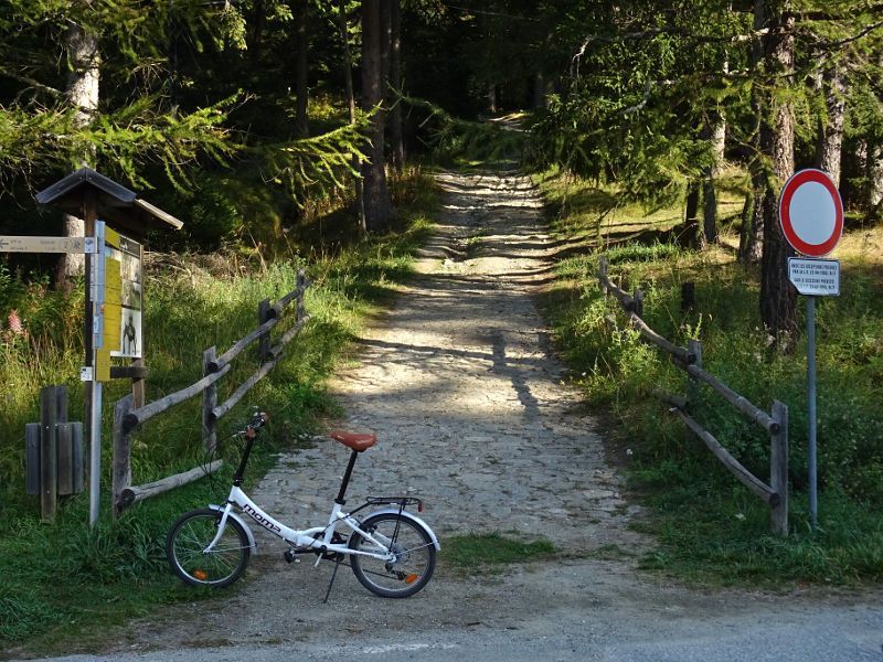 bicycle  at the entrance of the Ru Courtaud trail at Col de Joux, Aosta Valley